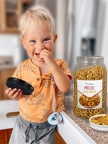 child eating pretzels